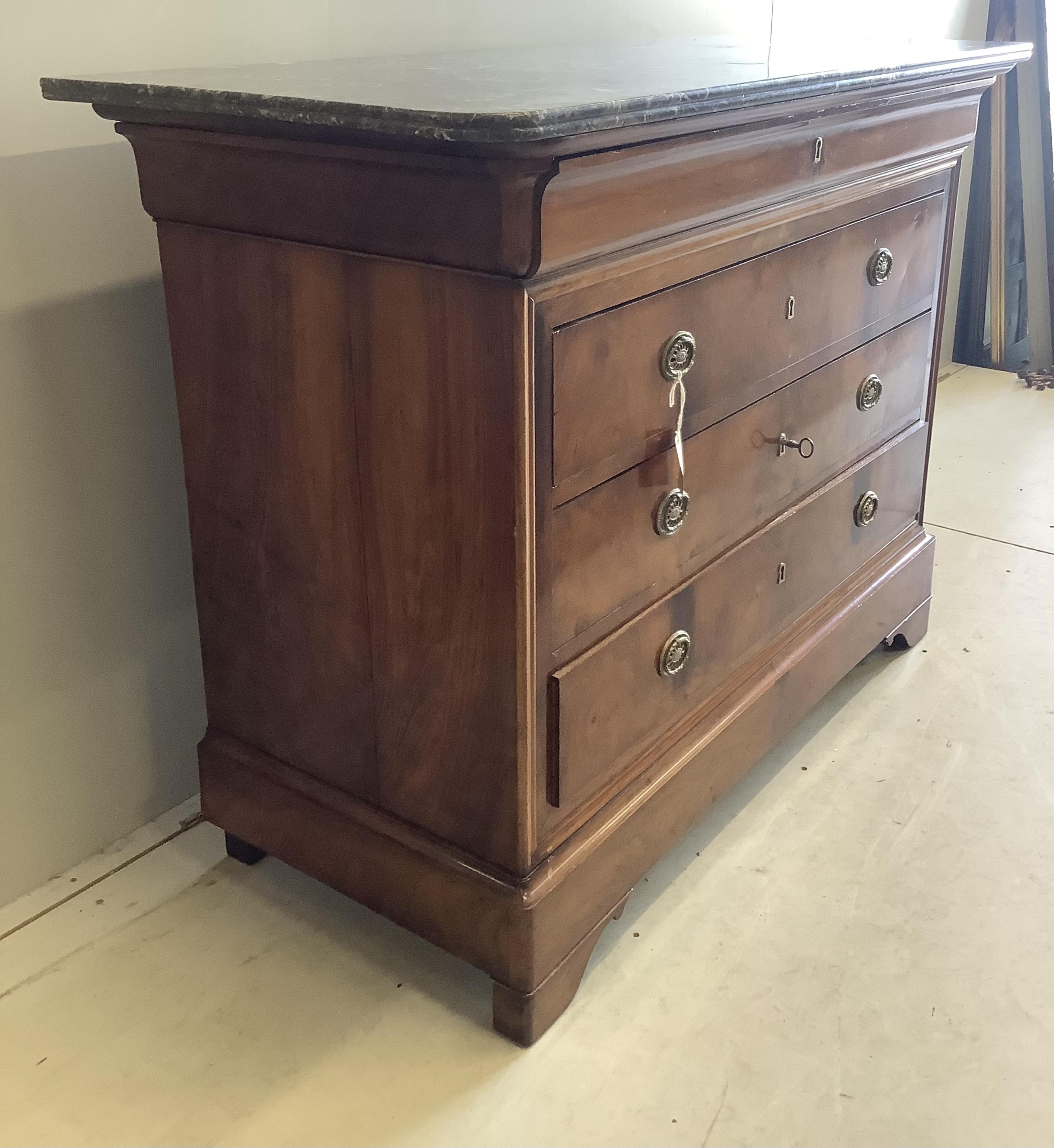 A 19th century French walnut marble top commode, width 130cm, depth 60cm, height 99cm. Condition - good